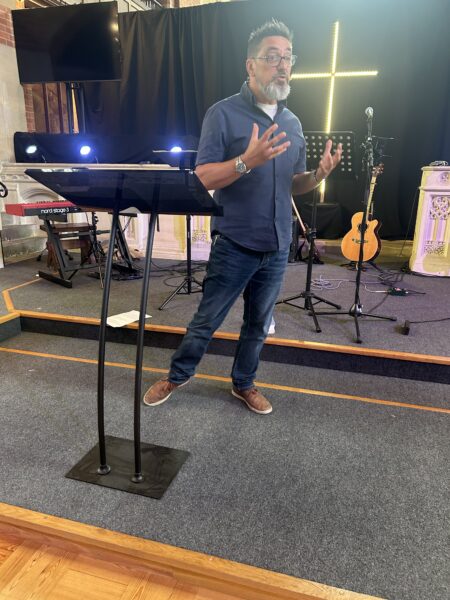 Paul Hatcher speaking in church